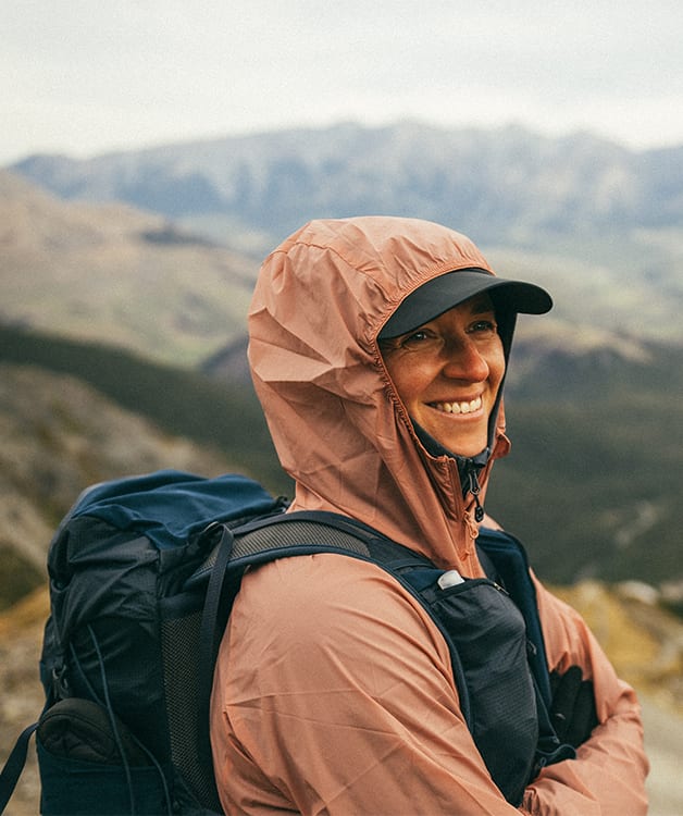 Women walking on a forest path in outdoor gear