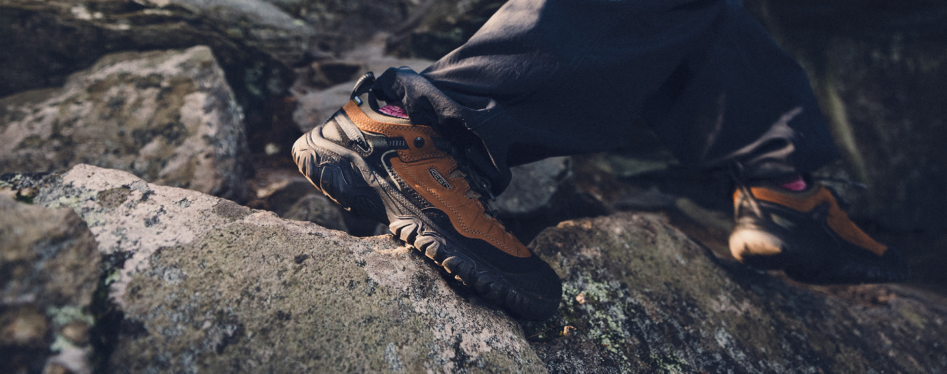 Man walking a muddy trail with waterproof boots